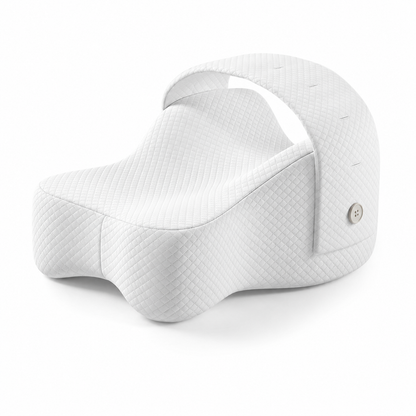 A white quilted ergonomic support cushion with a curved top handle and a small silver button, shown on a clean white background.